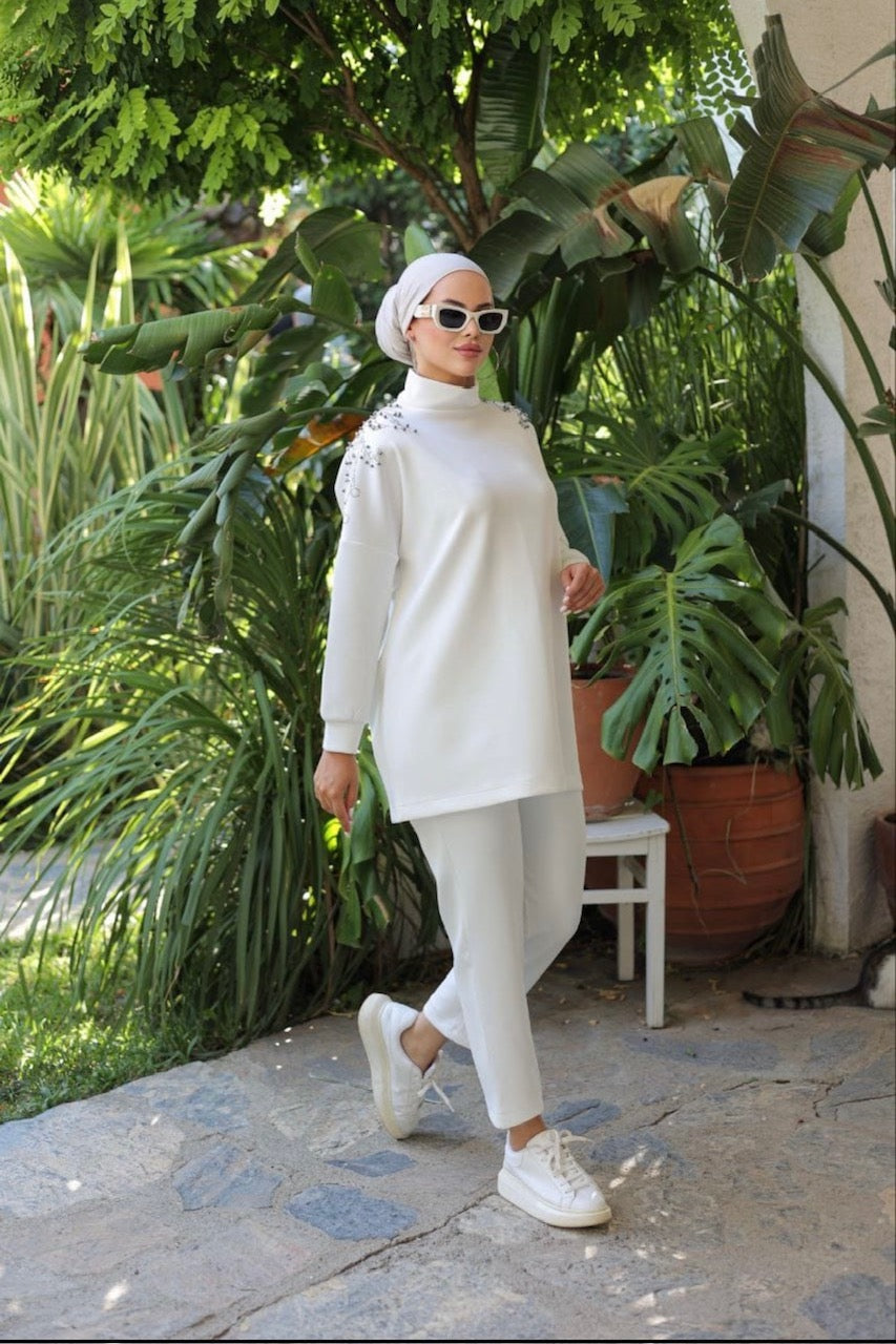 chic, light beige long-sleeved turtleneck top with pants