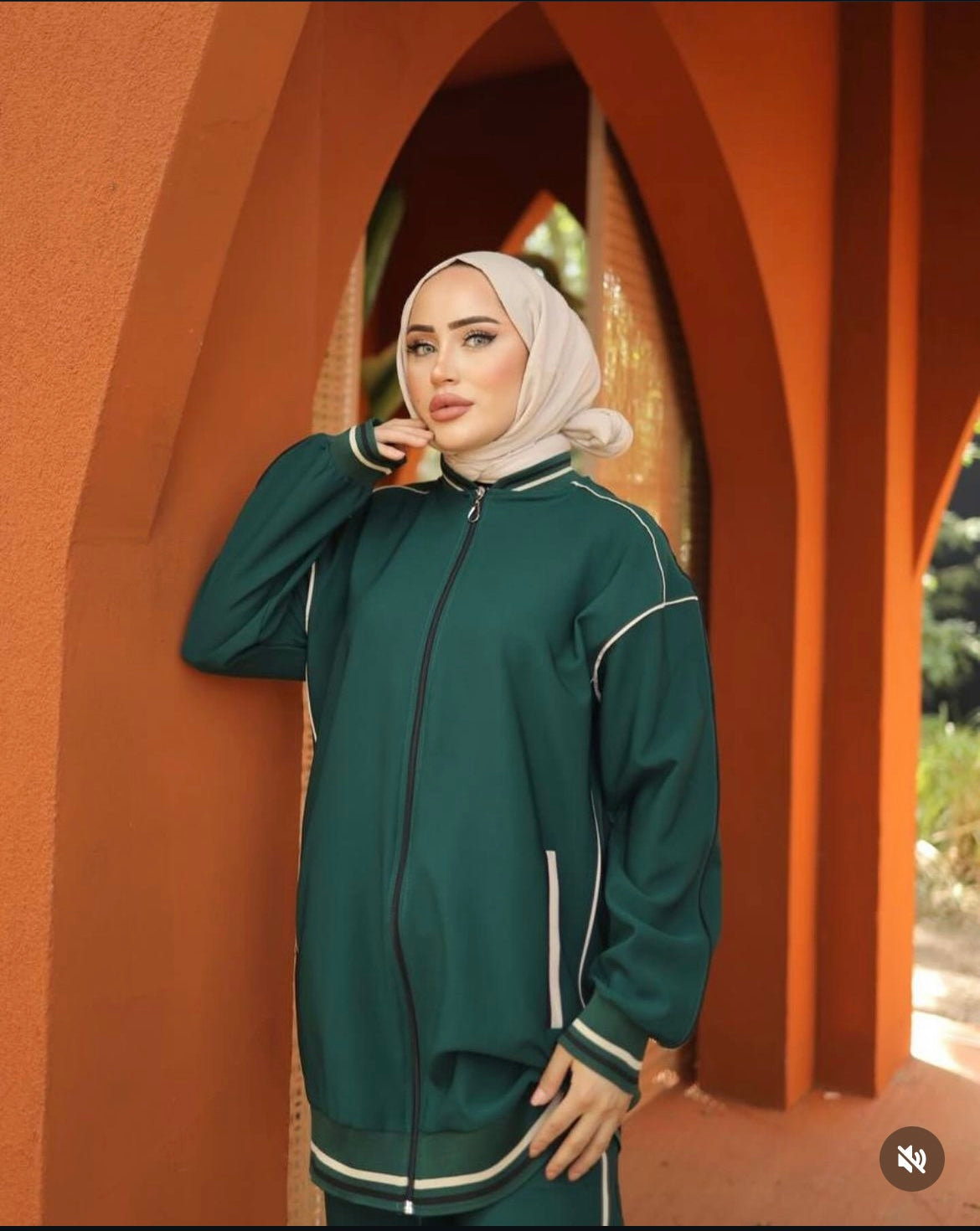 loose-fitting green tracksuit with beige line and  matching pants